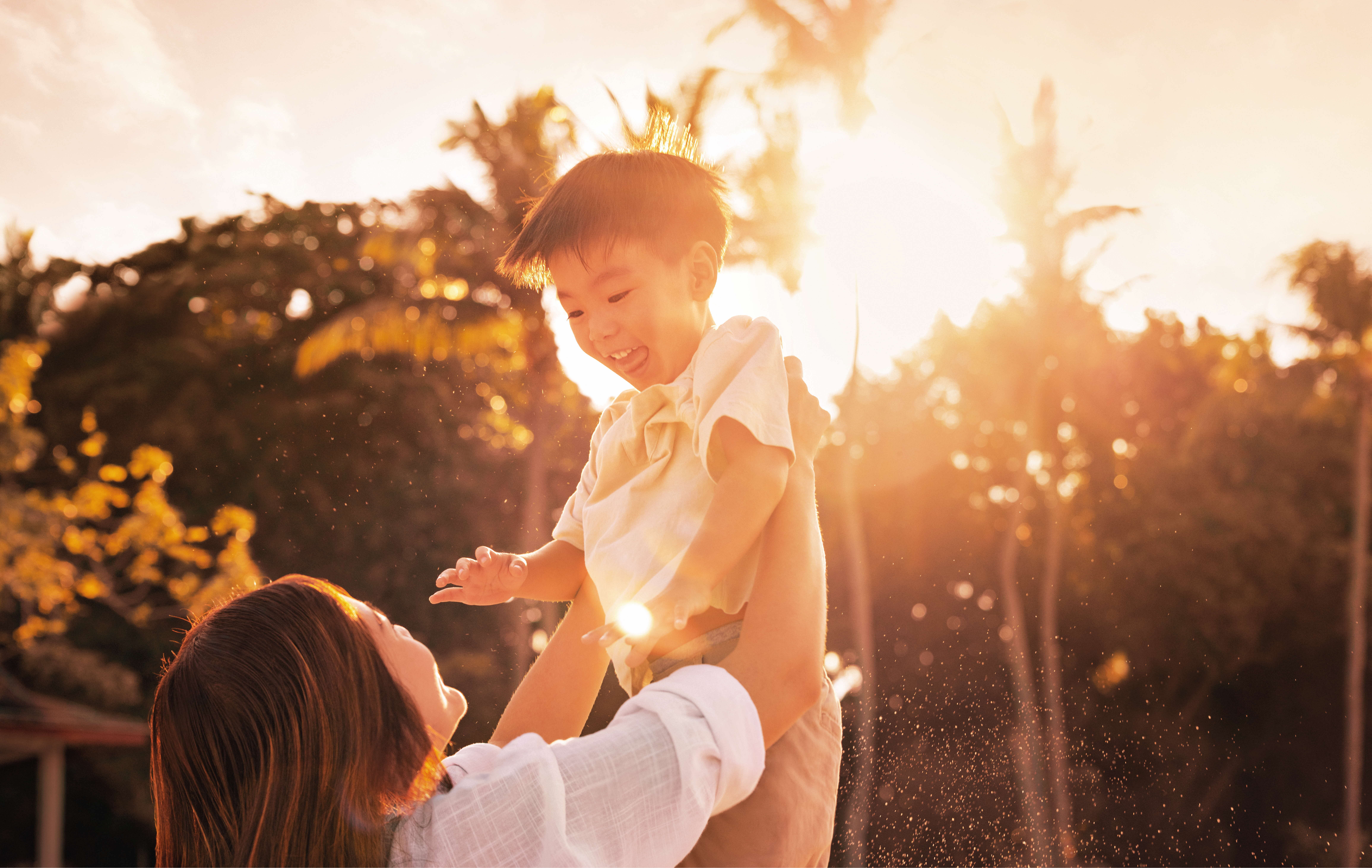 Photo of mother holding child at Tanjong Beach